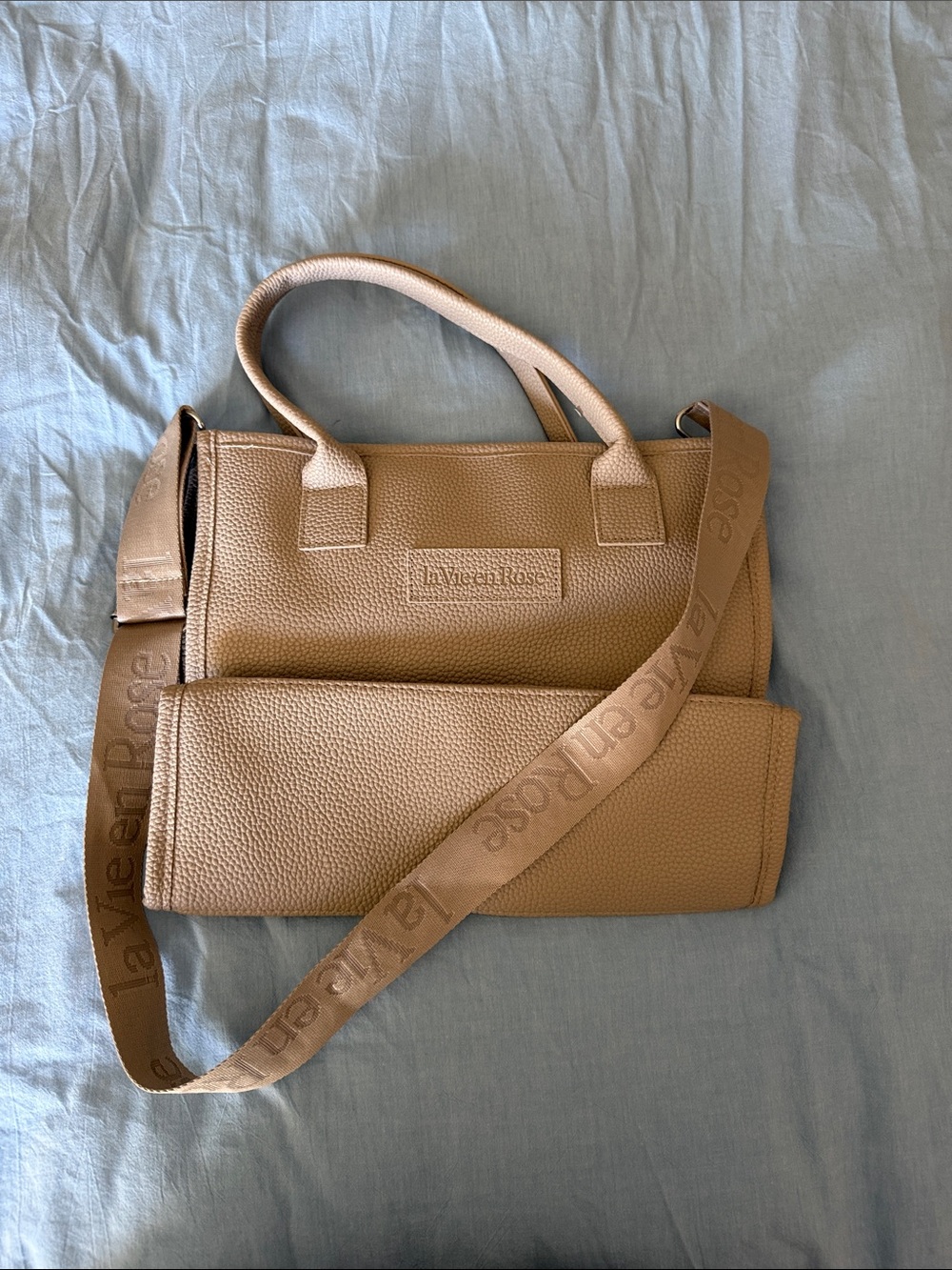 La Vie En Rose Beige/Tan Pebbled Leather Messenger Bag with Logo Strap